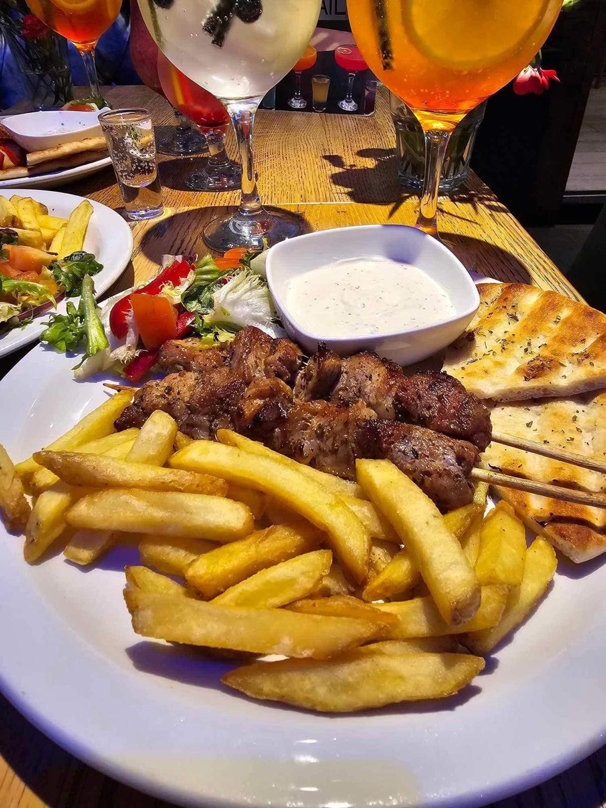 Grilled chicken with chips and salad