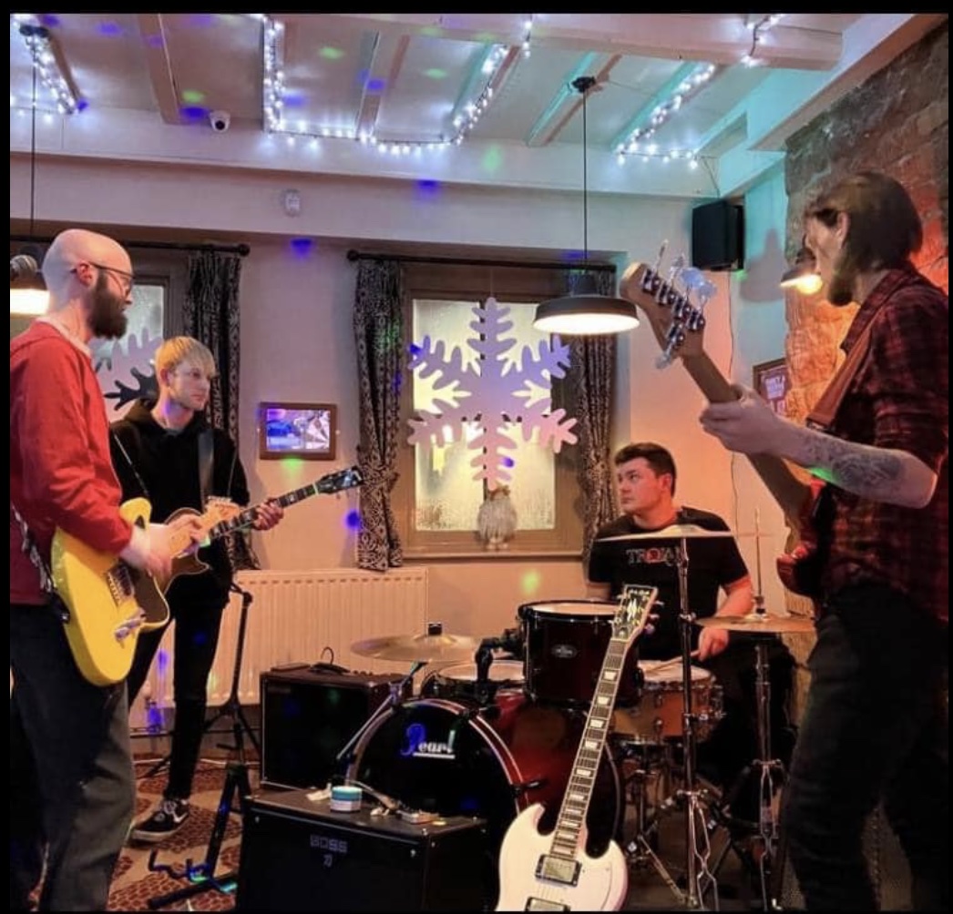 A live band playing at qube
