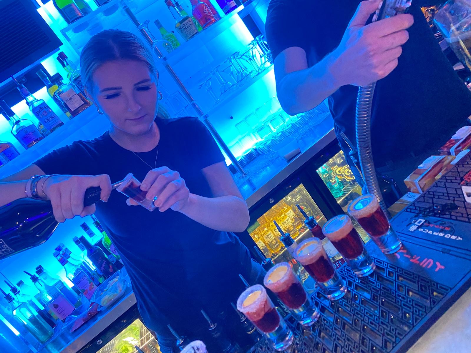 Shots being poured at the bar